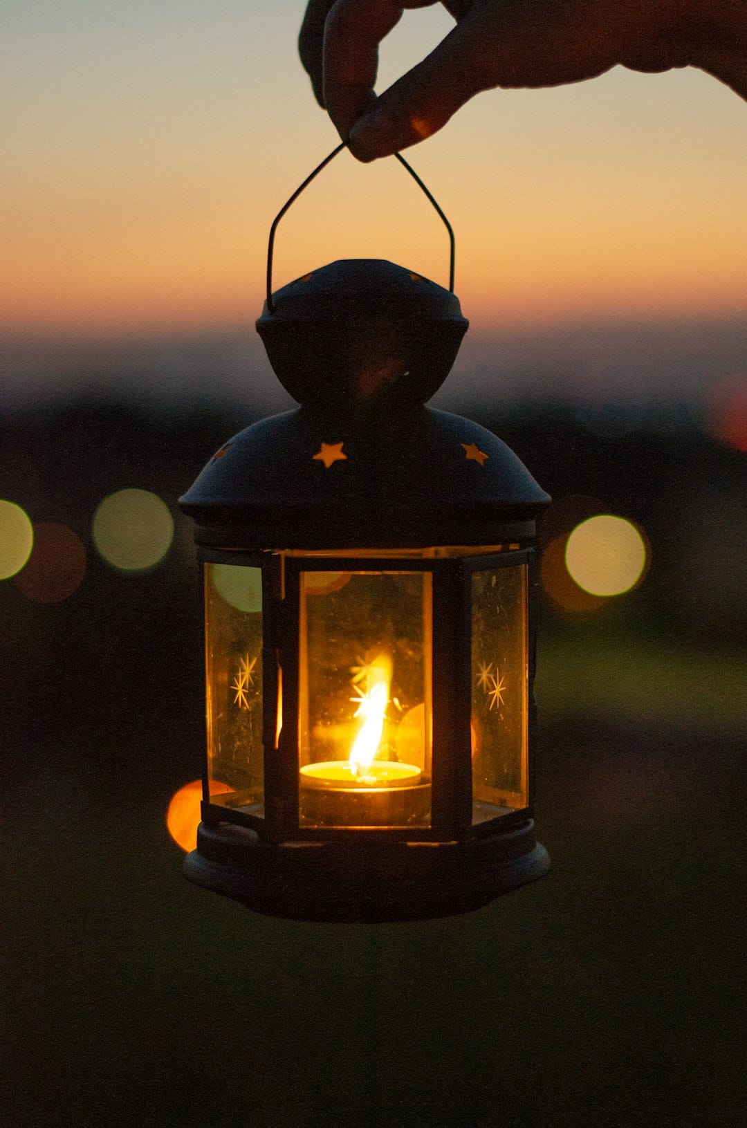 black lantern with fire during night time