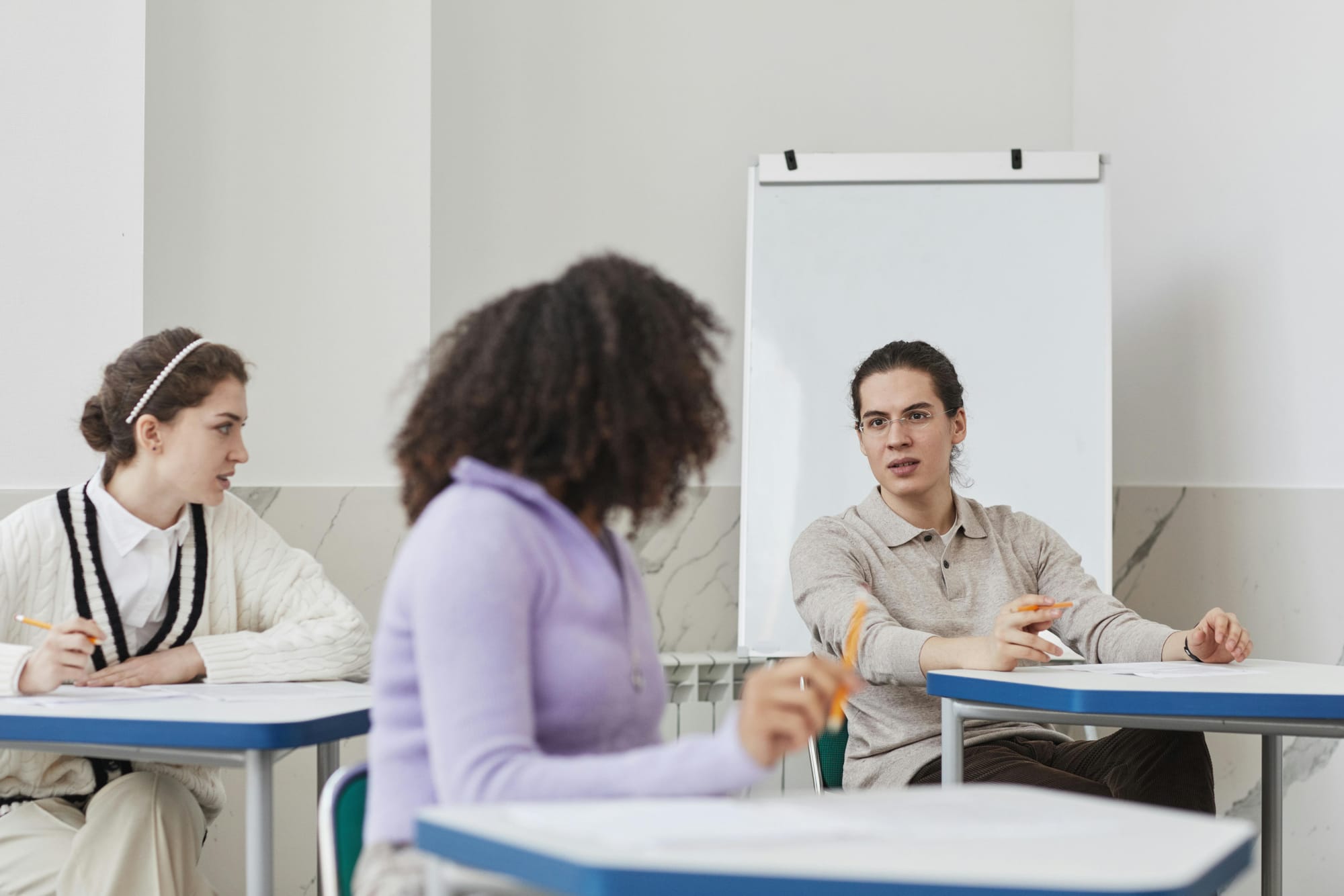 Adult students talking in class