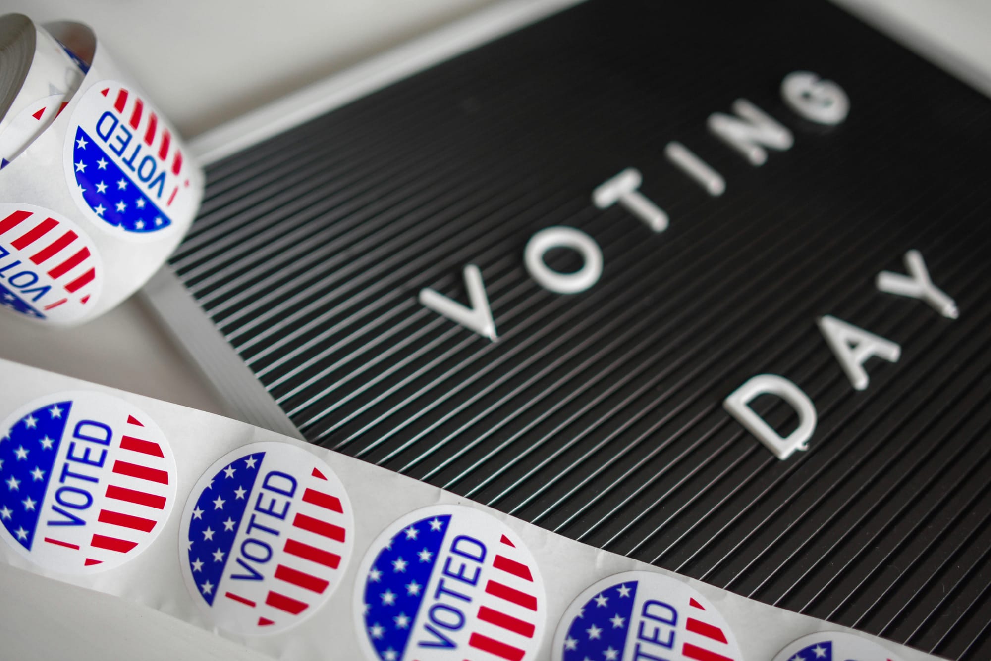 Letter board that reads "Voting Day" alongside a roll of "I voted" stickers. The 2024 Burlington Town Election is April 6, 2024.