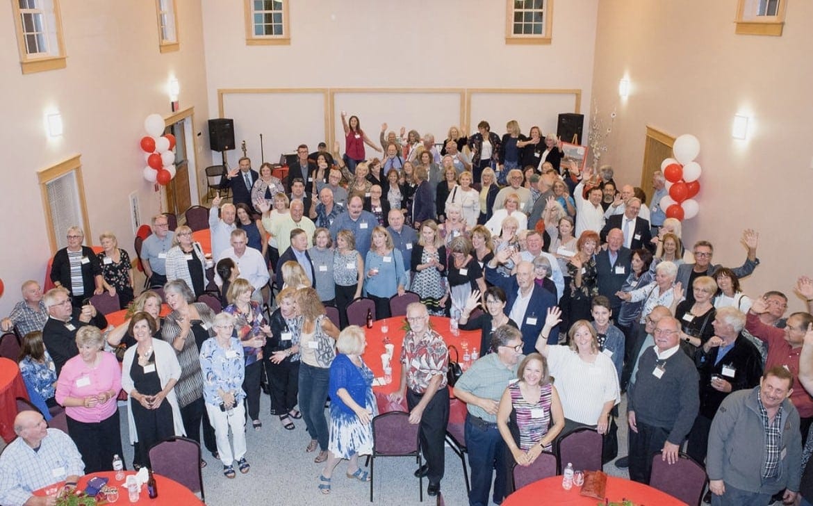 A photo of the attendees of the Class of '69 taken from the balcony at Grand View Farm