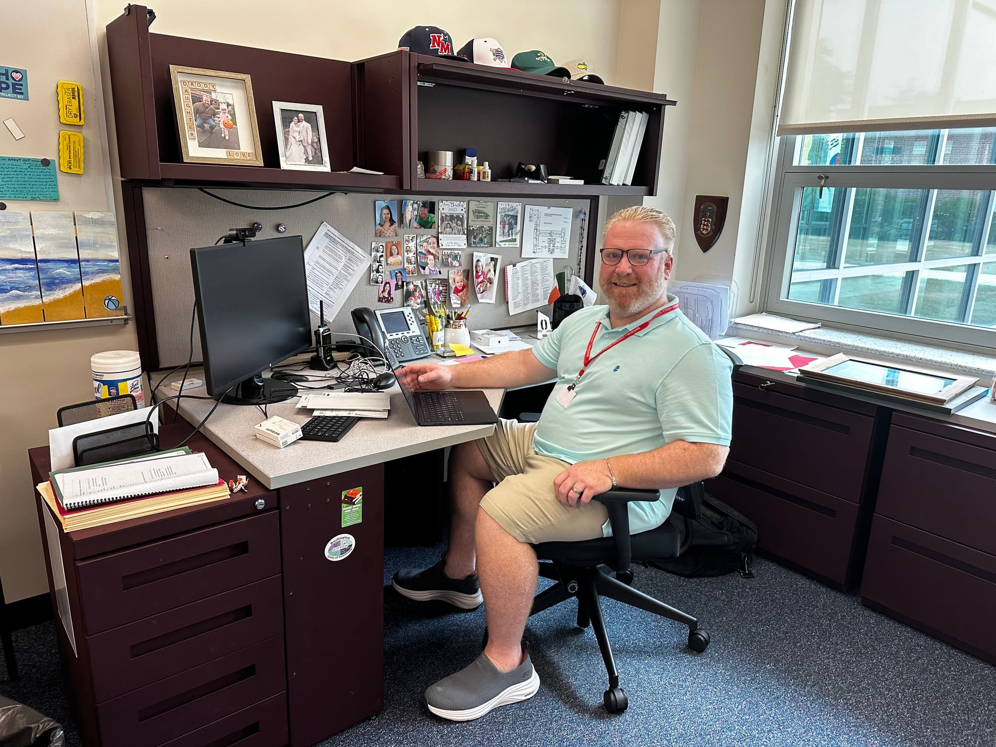 Tim McMahon, the new principal at Marshall Simonds Middle School, works at his desk in preparation for the new school year.