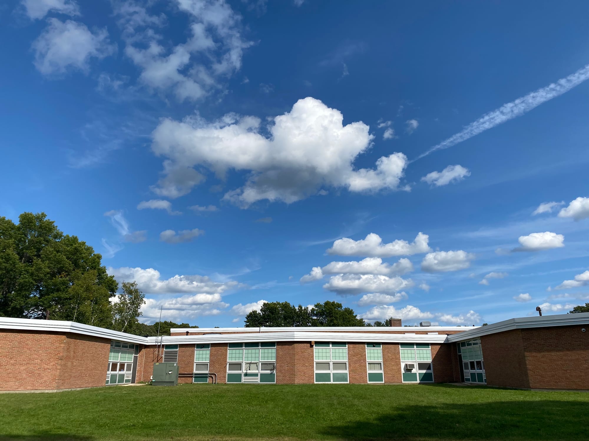 A side view of Fox Hill Elementary School in Burlington, MA, on a clear, sunny day.