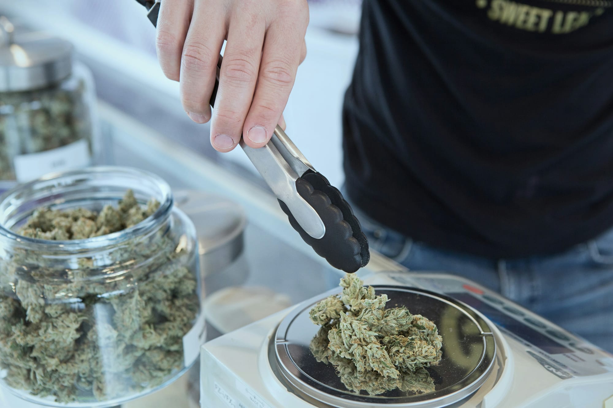 marijuana being weighed out at a dispensary