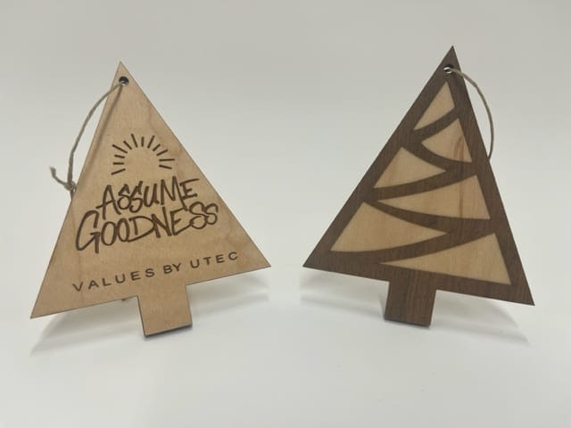 Two wooden tree-shaped ornaments