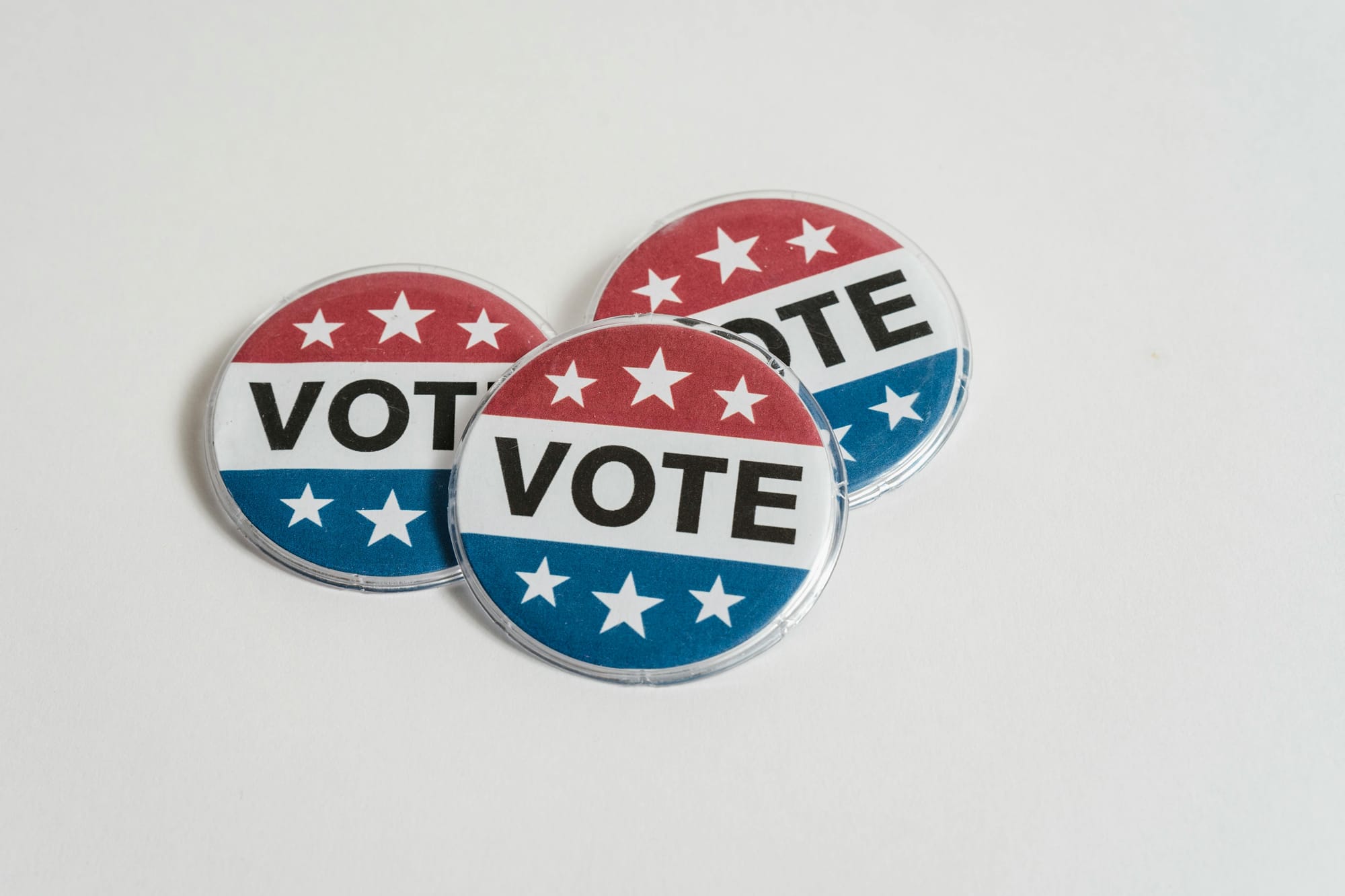 US Voting Badges on White Surface
<p>" class="wp-image-9205"><figcaption class=