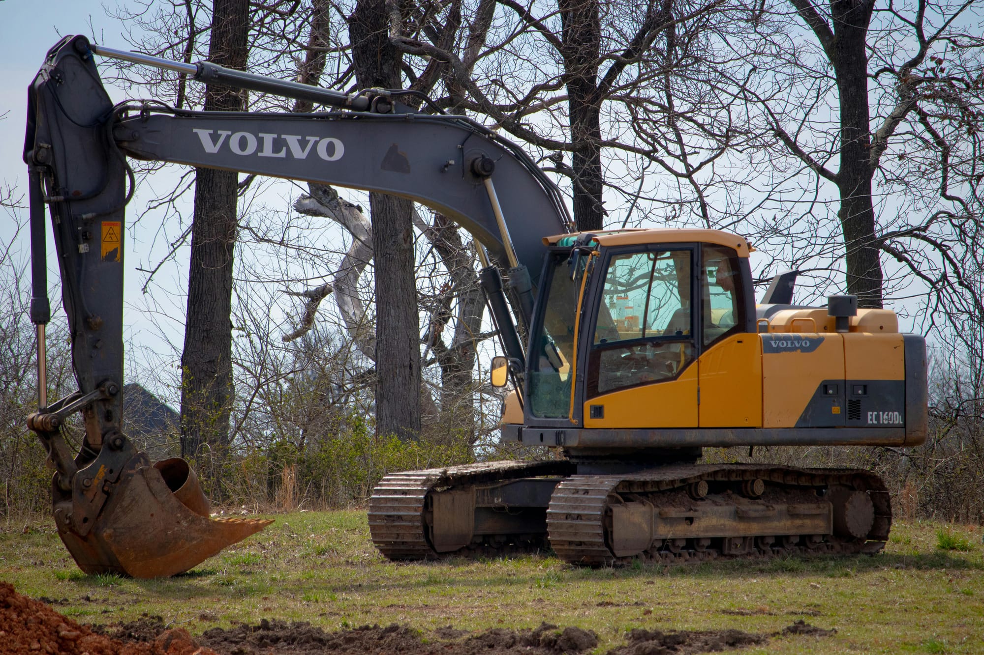 Yellow and Black Excavator on Green Field Near Leafless Trees
<p>" class="wp-image-9220"><figcaption class=