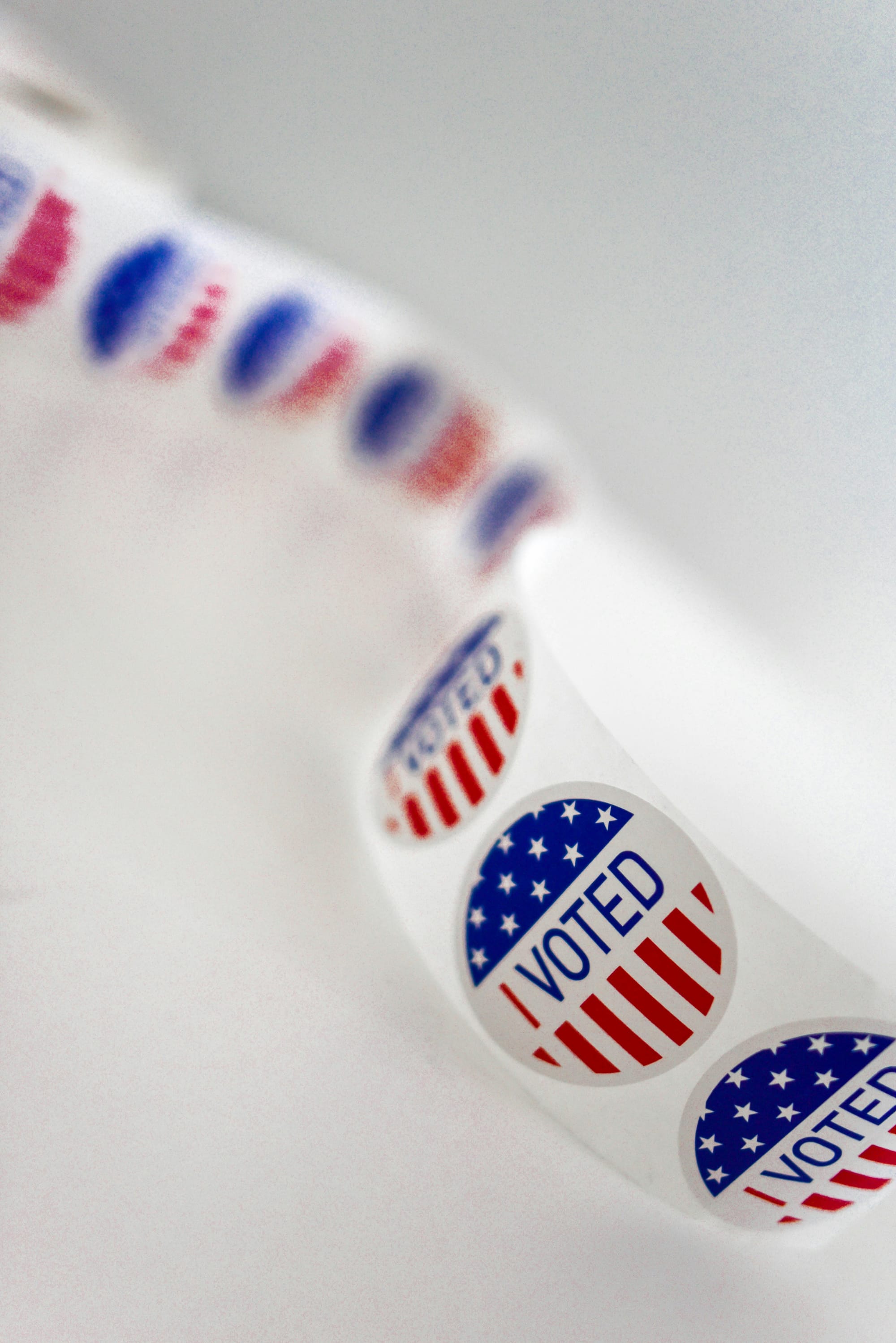 Sticker tape with American flag and I voted text